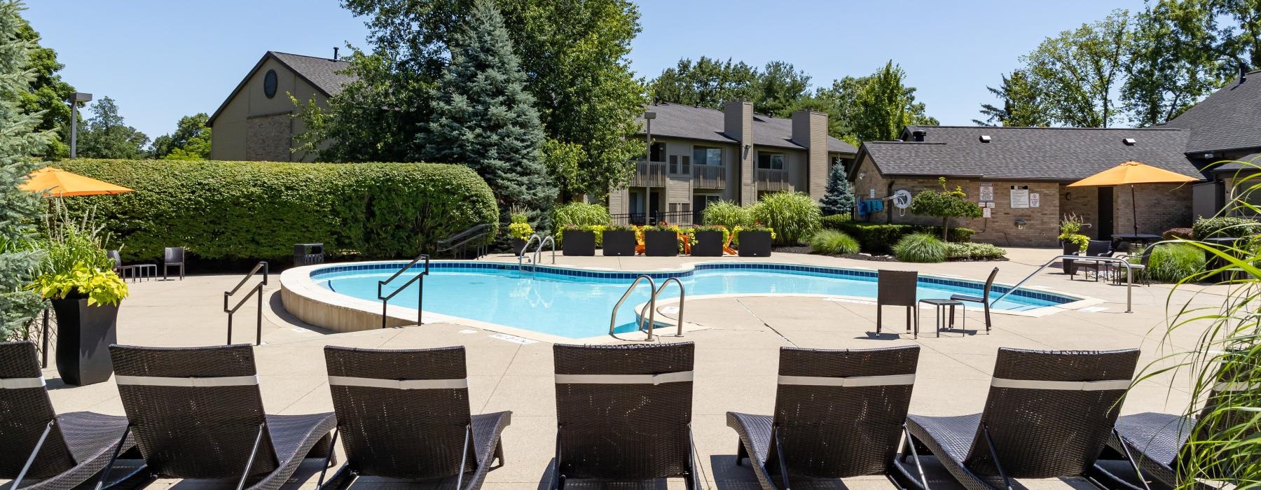 a pool with chairs around it