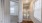 a hallway with a door and windows