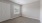 a room with white doors and a window