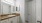 a bathroom with white cabinets