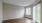 a room with a wood floor and a glass door